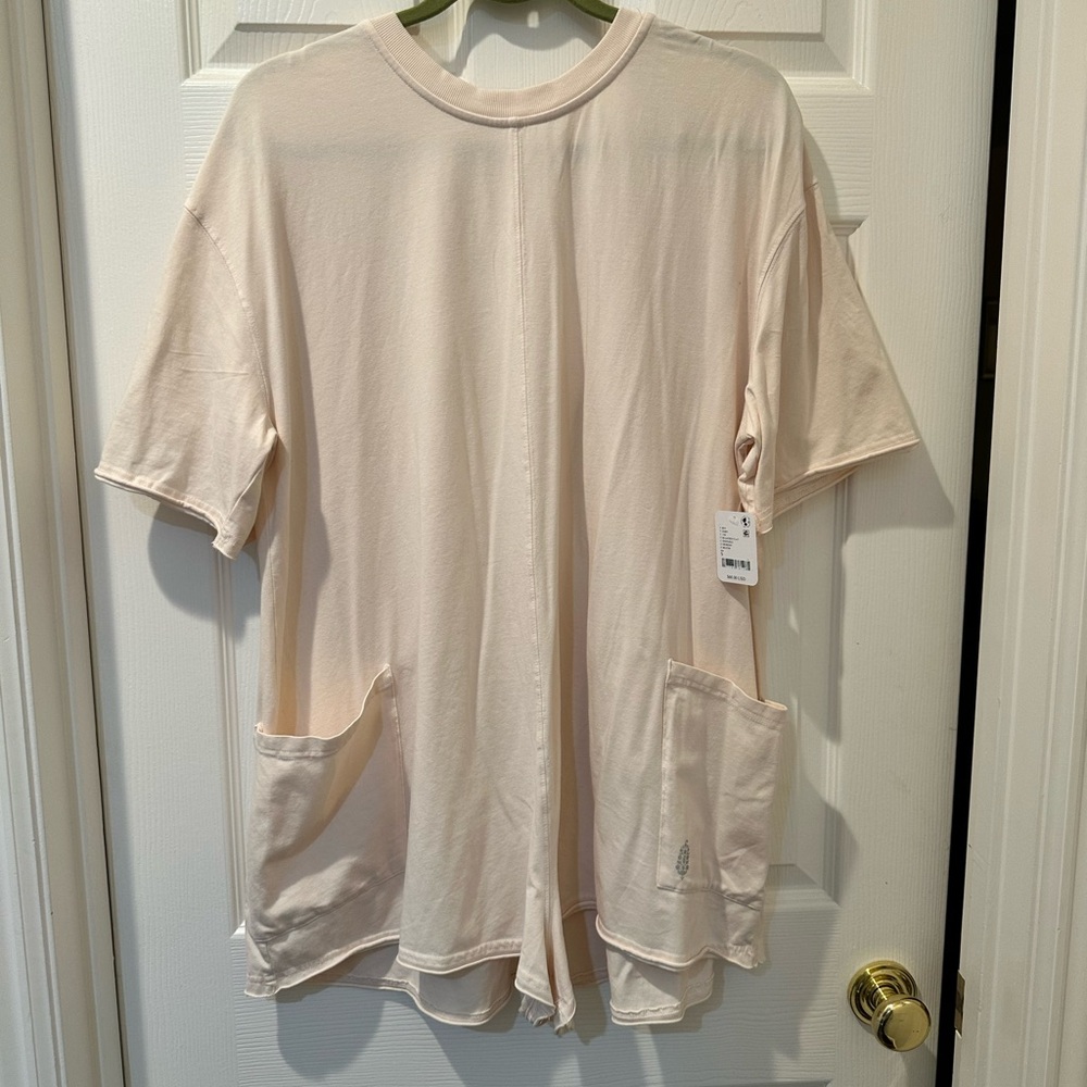 Free People Cream romper! Pair it with some cute boots or hang out at the beach.
